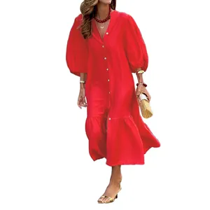Close-up of red vacation midi dress showing the puff sleeve and ruffle hem detail