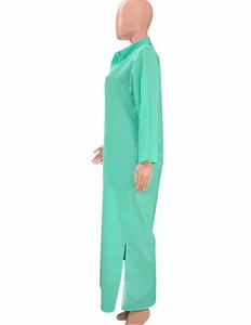 Side view of a casual green long-sleeved shirt dress with side slits and collar.