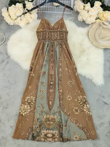 Detailed view of the vintage floral print on a summer spaghetti strap maxi dress