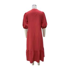 Back view detail of a red midi dress with elegant puff sleeves and tiered ruffle hem
