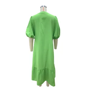 Back view of a vibrant green loose puff sleeve midi dress for casual vacation style