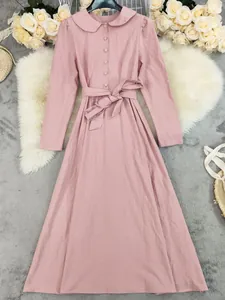 Elegant pink long-sleeved cotton linen maxi dress with Peter Pan collar and waist tie
