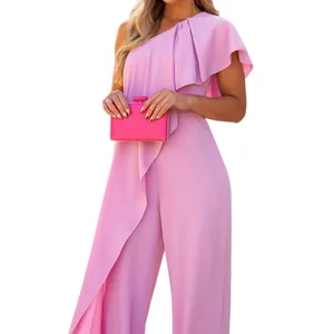 Detail view of pink one-shoulder jumpsuit with ruffle overlay and wide legs