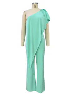 Elegant light green one-shoulder jumpsuit for women with ruffled drape detail on a mannequin