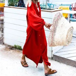 Elegant loose-fitting red holiday maxi dress with waffle texture and long sleeves