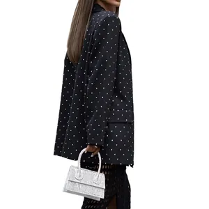 Elegant black polka-dot blazer jacket with lapels for a stylish spring look.