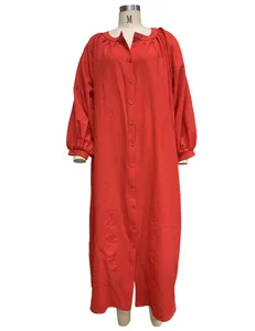 Front detail view of red loose holiday long cardigan dress displayed on a mannequin