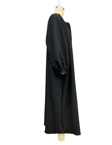 Elegant black long-sleeved loose maxi cardigan dress for women shown on mannequin