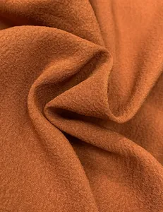 Macro view of high-quality terracotta fabric texture with natural drapery and folds