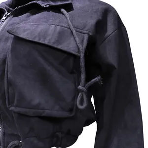 Close-up of a black casual sports jacket detail showing pocket flap and drawstrings