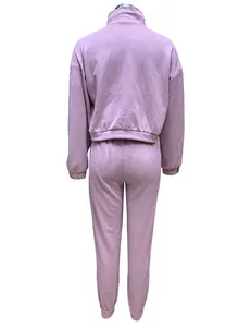 Back view of a mauve two-piece casual tracksuit for women with joggers