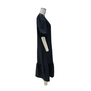 Side view of elegant black midi dress with puff sleeves and ruffled hem details