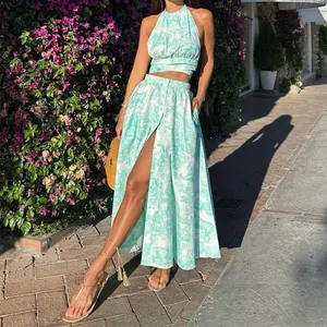 Detail view of teal toile print vacation two-piece set with halter top and slit skirt
