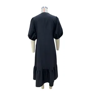 Back view of a black holiday midi dress featuring puff sleeves and ruffled hemline