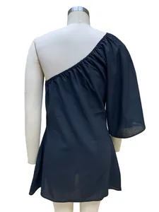 Elegant black one-shoulder cotton linen loose dress shown on a white mannequin