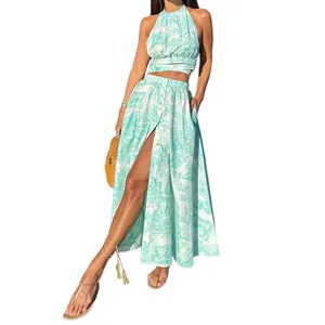 Elegant two-piece vacation set featuring printed halter top and high-slit long skirt