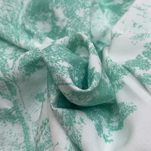 Detailed view of green and white toile de jouy print fabric for summer vacation outfit set
