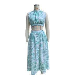 Full view of floral print two-piece vacation set with crop top and button maxi skirt
