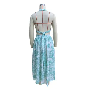 Back view of green Toile de Jouy print crop top and maxi skirt set on mannequin