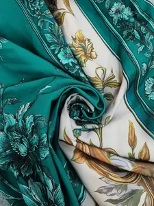Close-up detail of vintage emerald green floral print fabric for a summer maxi dress