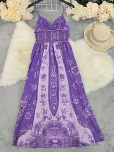 Close-up of vintage floral print on purple cami maxi dress with smocked bust