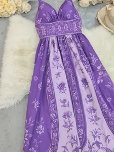 Elegant detail of purple vintage floral print on a backless summer slip maxi dress