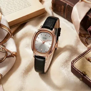 Montre GEDI vintage pour femme avec boîtier ovale en or rose et bracelet en cuir noir sur tissu