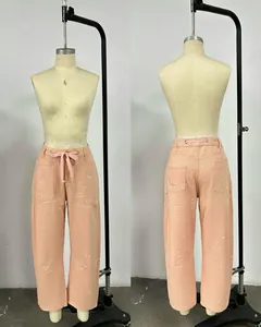Vues détaillées avant et arrière du pantalon pêche avec des éclats de peinture.