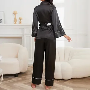 Elegant black faux silk pajama set for women with white piping and adjustable tie-waist