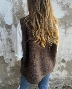 Back view of a cozy brown sherpa fleece vest jacket ideal for autumn and winter layering