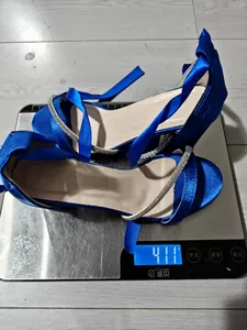 Elegant blue satin block heel sandals with rhinestone straps showing a weight of 411g.