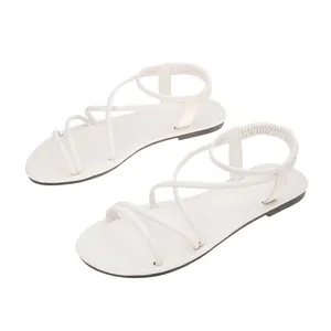 Top view of white soft leather Roman flat sandals with non-slip sole for beach wear