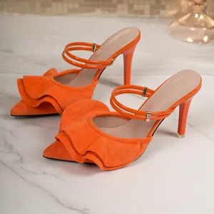 Detailed view of orange ruffled pointed-toe high heel mules with elegant double straps
