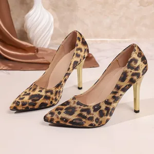 Elegant leopard print stiletto heels with a pointed toe and a shiny gold heel detail