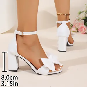 Elegant white satin block heel sandals featuring a bow and detailed 8cm heel measurement.