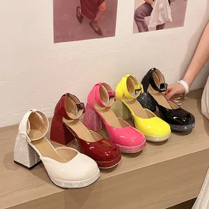 Detail shot of multi-colored patent leather Mary Jane pumps with rhinestone platform heels