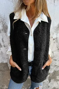 Detailed view of a cozy black lamb velvet fleece button vest styled with a white shirt