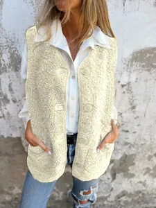 Close-up view of a cozy cream fleece vest with buttons worn over a white shirt and jeans.