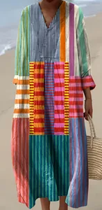 Detailed view of the vibrant geometric patchwork print on this long-sleeved shirt dress