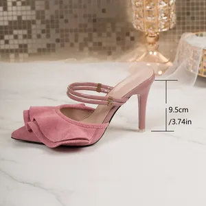 Close-up detail of elegant pink ruffled pointed-toe high heel mule showing 9.5cm stiletto