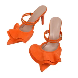 Vibrant orange pointed-toe high heels featuring elegant ruffled edges and a slim stiletto heel.