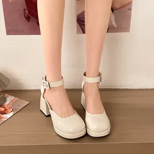 Close-up of elegant beige patent leather Mary Jane shoes with chunky platform heels