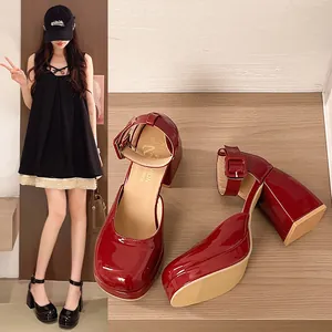 Detail view of wine red patent leather Mary Jane shoes with chunky high heels