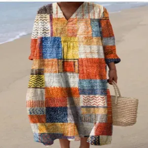 Full view of a casual long sleeve maxi dress featuring vibrant 3D geometric print on beach