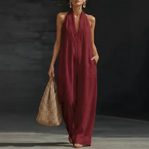 Elegant burgundy sleeveless halter neck jumpsuit with wide legs and deep V-neck for women