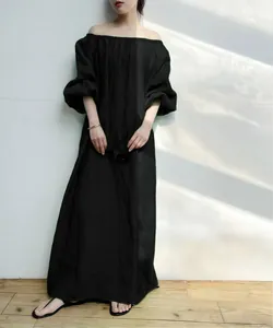 Elegant black off-shoulder maxi dress with puff sleeves and loose fit