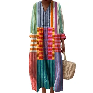 Vibrant patchwork long sleeve shirt dress with colorful vertical stripes and V-neckline.