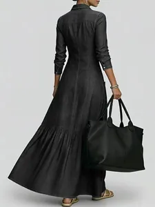 Full length back view of vintage black denim maxi dress with tiered skirt and collar