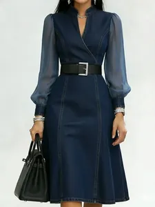 Elegant denim maxi dress featuring sheer long sleeves and a stylish stand collar design