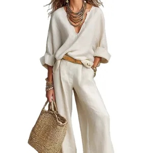 Elegant beige linen loose vacation set with V-neck top and wide-leg trousers